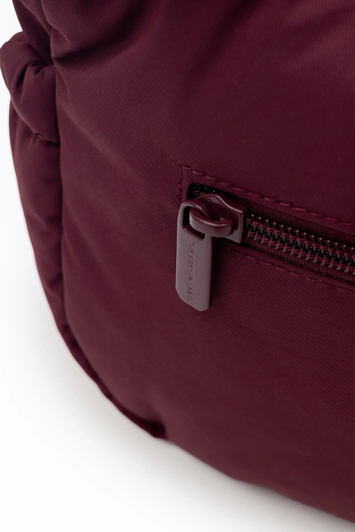 MINI SIGNATURE POCKET CROSSBODY BAG IN POSH WINE