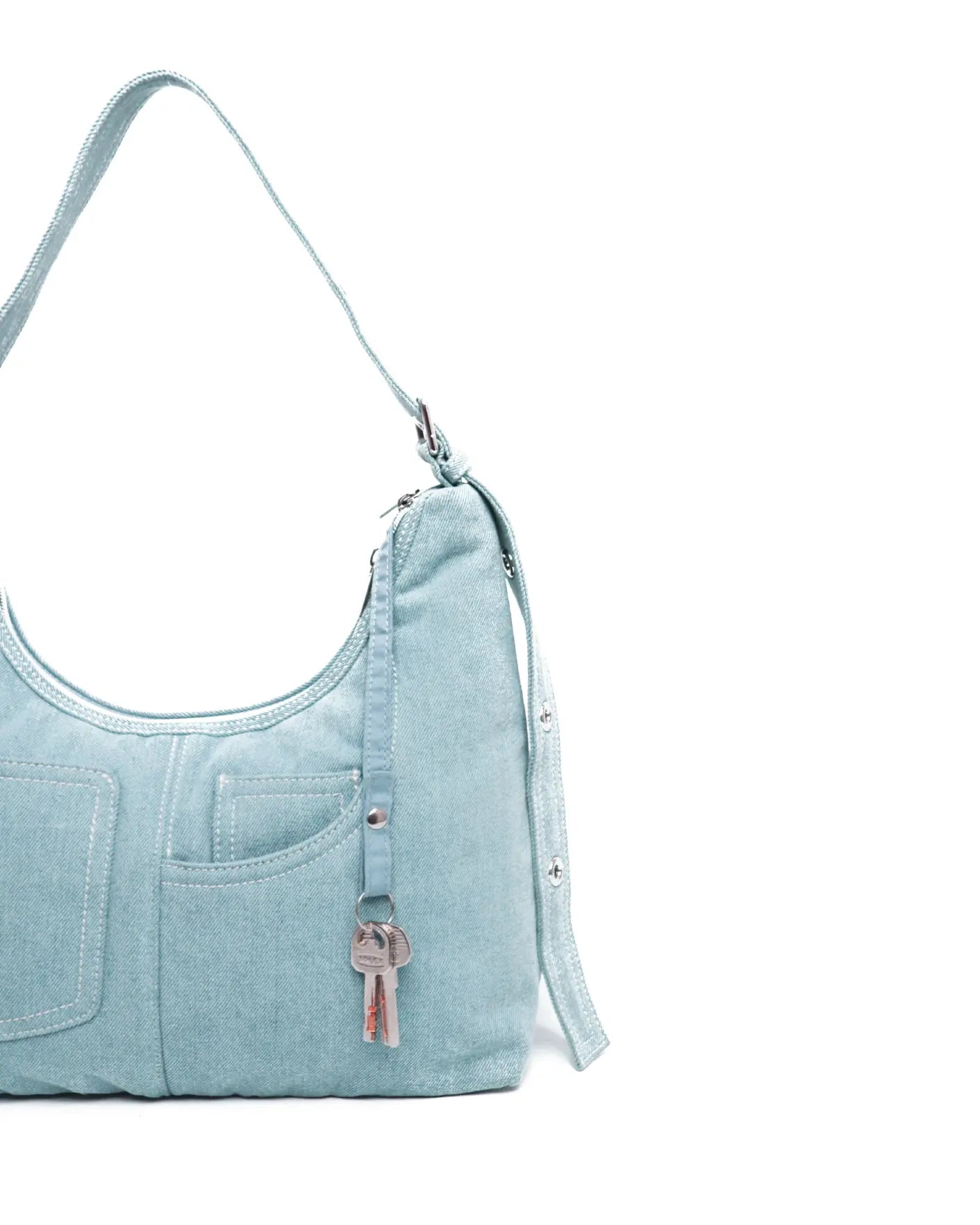 SIGNATURE POCKET HOBO BAG IN LIGHT WASH DENIM TSL Singapore