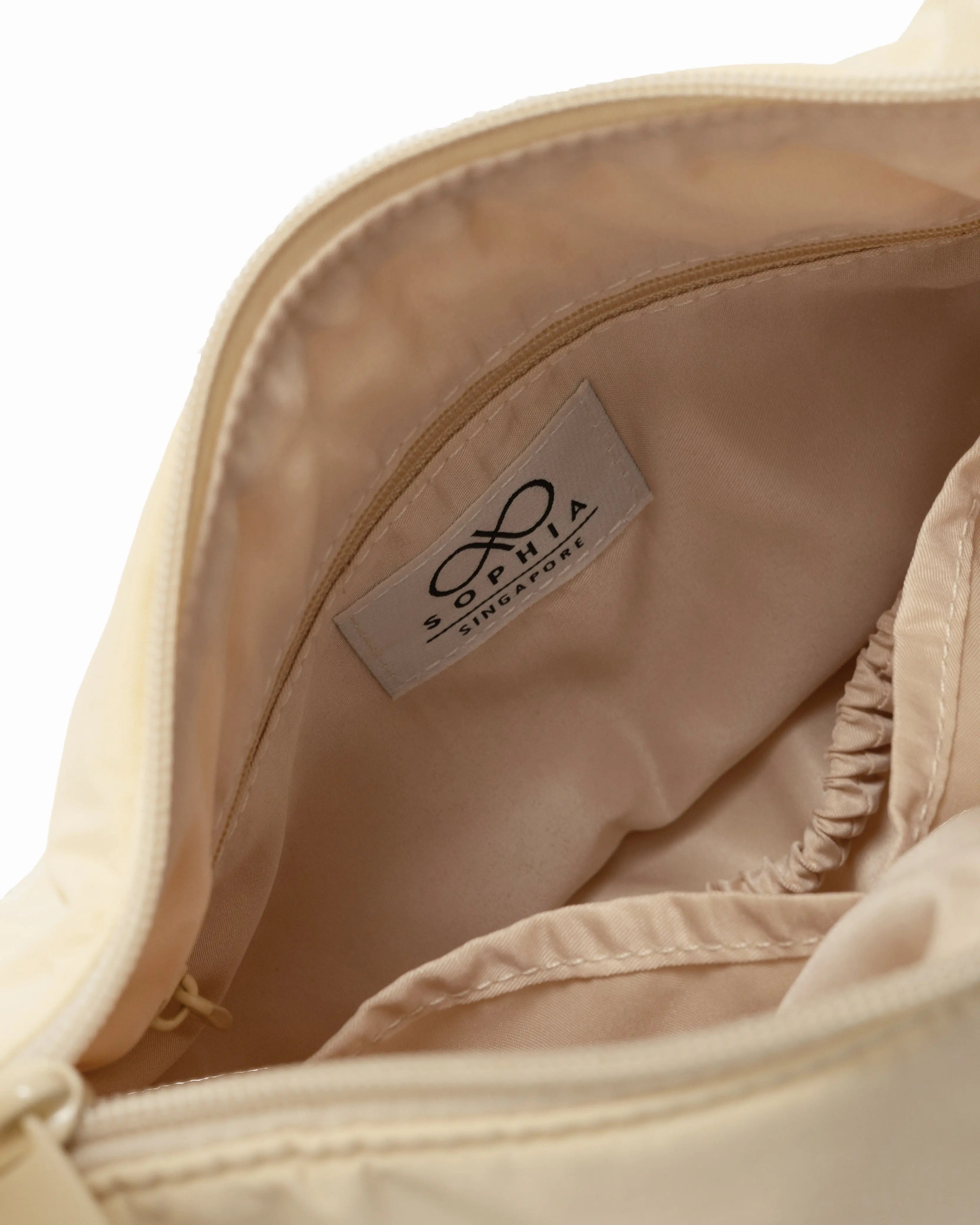 MINI SIGNATURE POCKET CROSSBODY BAG IN POSH MELLOW 